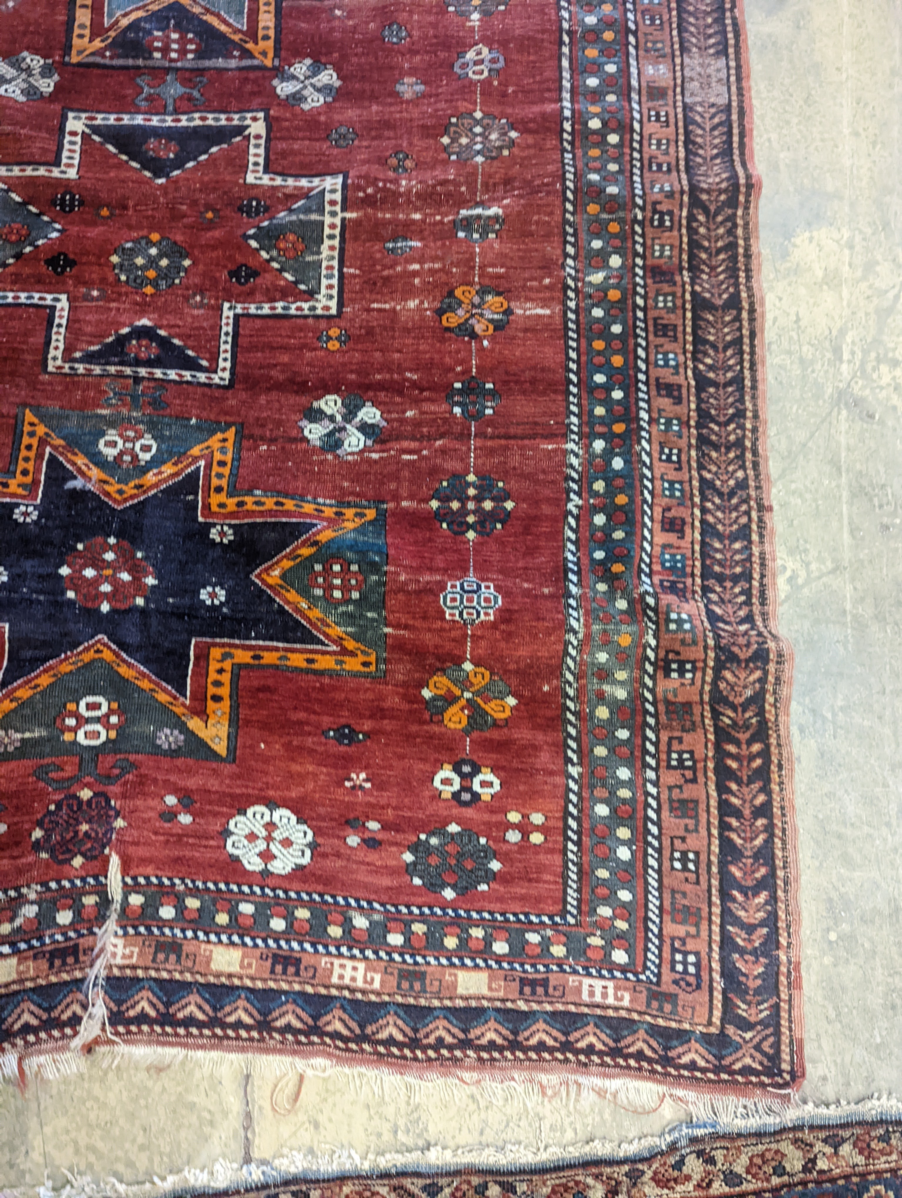 A Kazak red ground rug, 210 x 160cm